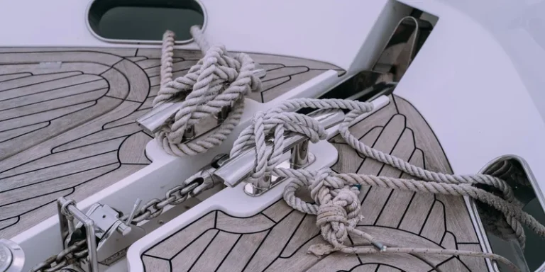 Detailed view of knotted ropes and chains on a boat deck