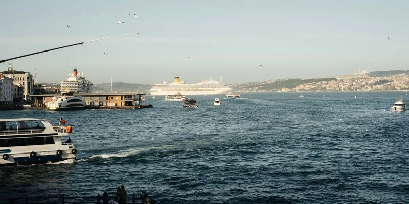 Cruise ships and boats navigating the Bosphorus in Istanbul on a sunny day